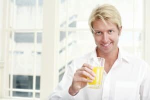 best glass of juice man enjoying